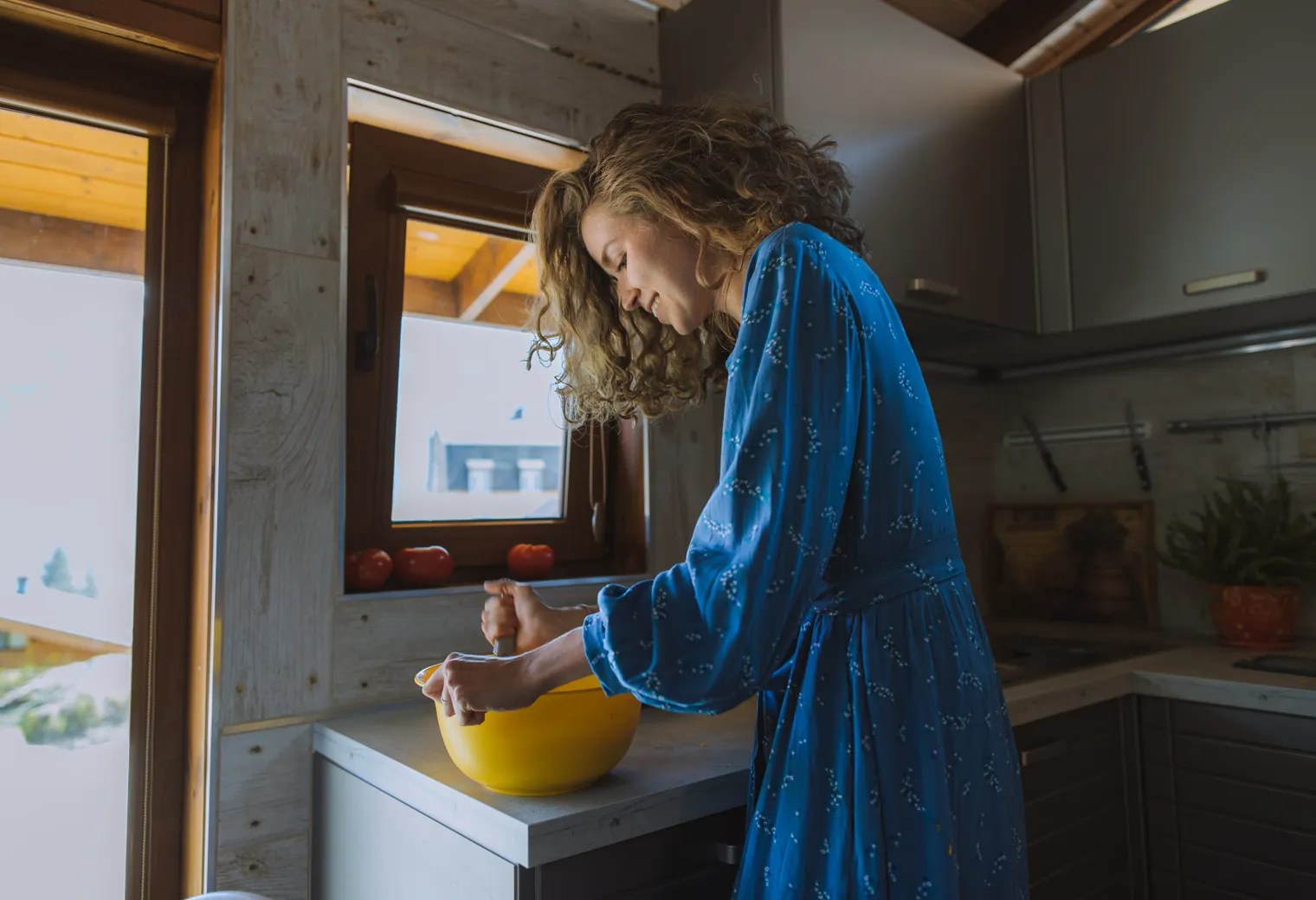 Woman enjoying a meaningful moment cooking at home