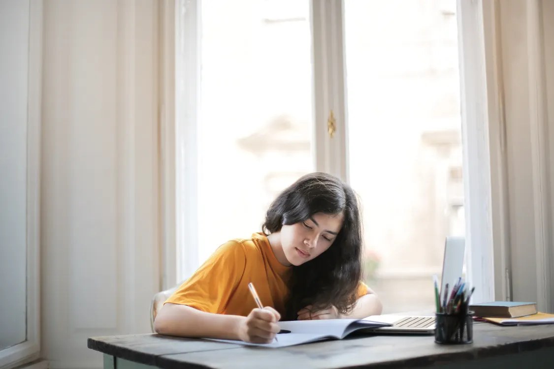 Woman working with calm focus at a desk